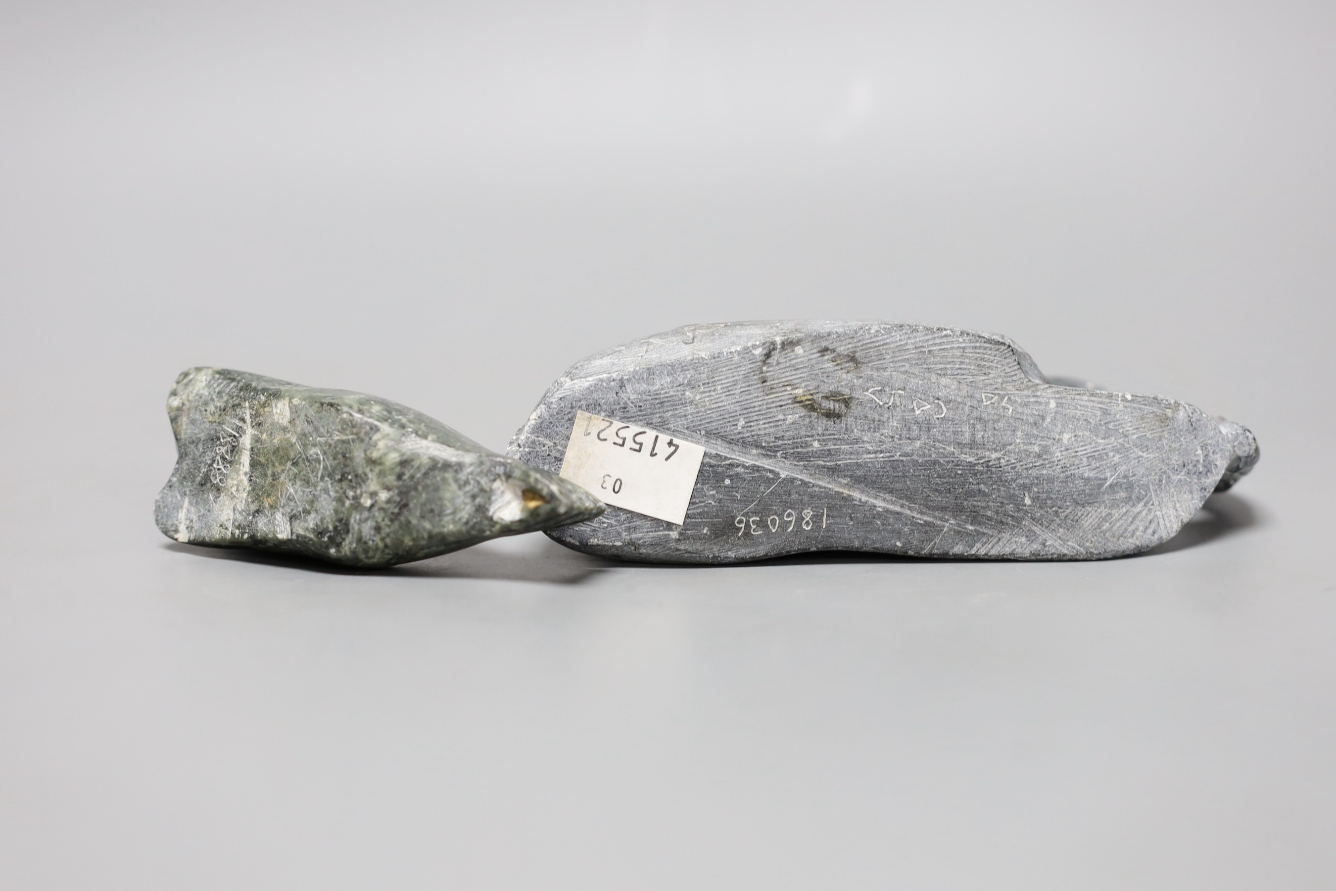 Three Inuit stone carvings, two seals and an otter. Largest 20cm long